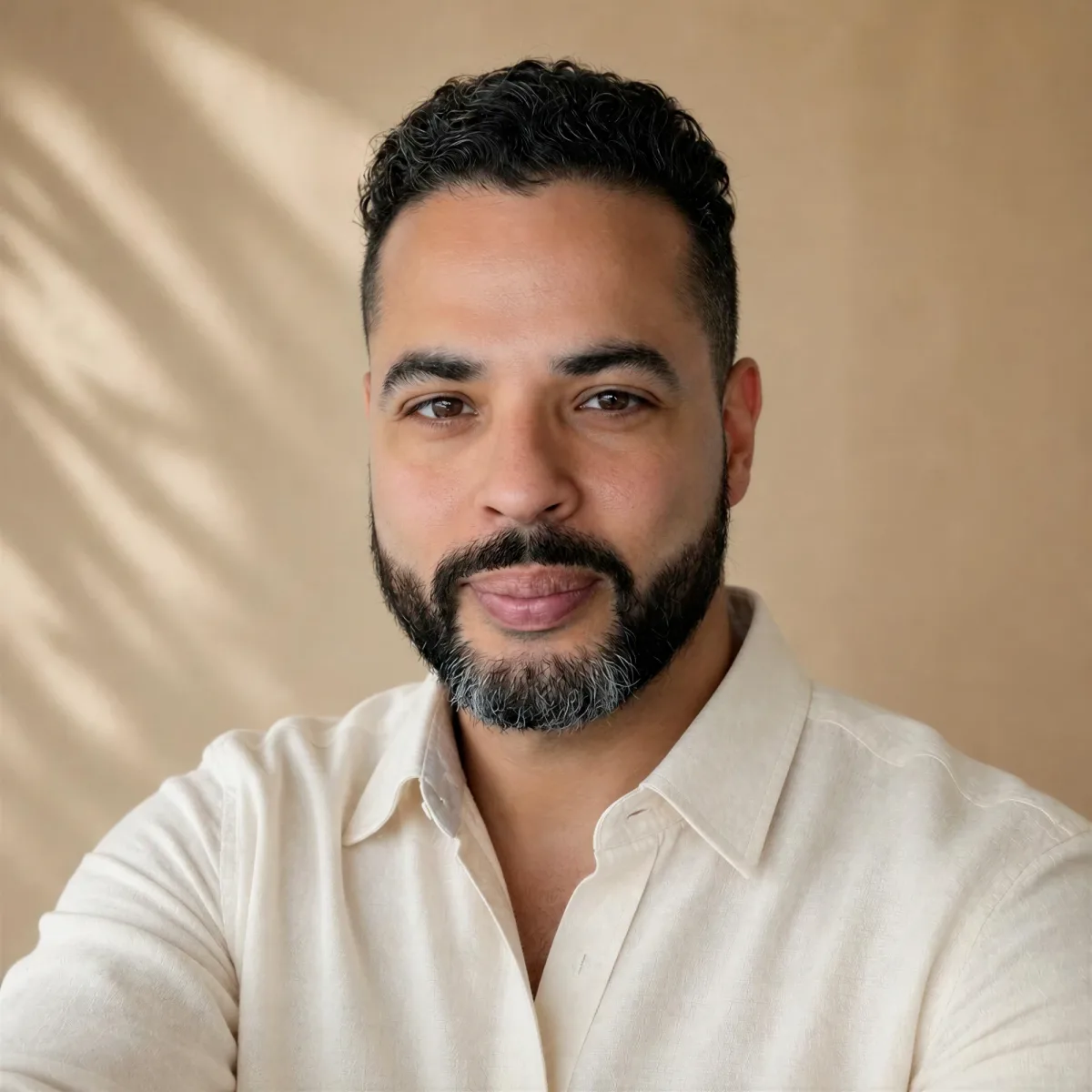 Nicholas Aponte-Rodriguez, founder of ASEC Services, in a cream shirt